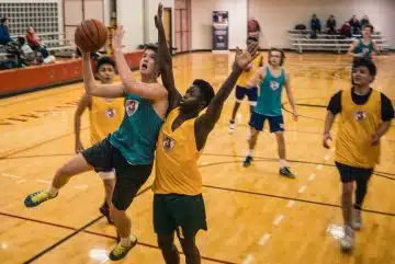 group of people playing basketball